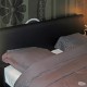 Bedroom with flowers - and circle motif on the front of the house. Double glazing and electric wooden shutters keep the noise out